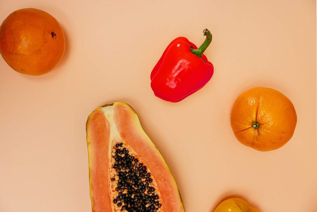 Papaya, red bell pepper, and oranges.