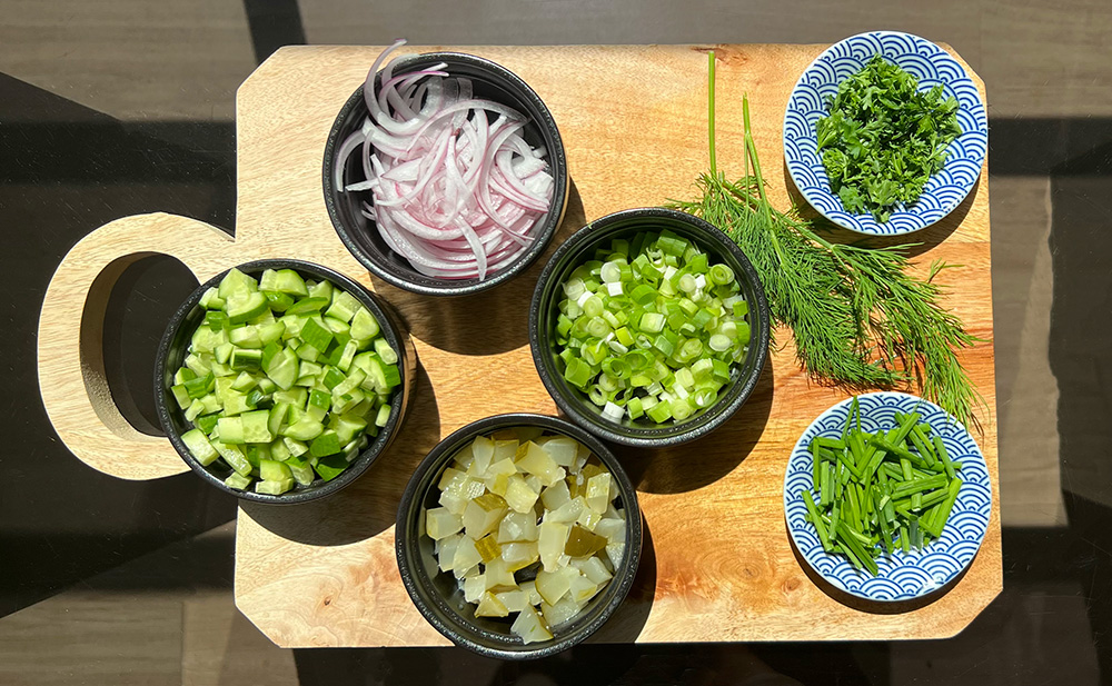 Chopped pickles, cucumber, red onion, green onion, chives, parsley, and dill.