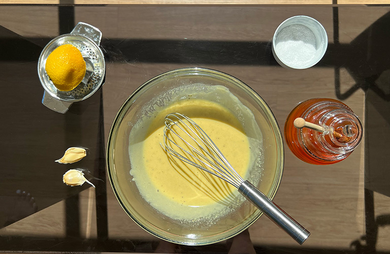 Liquid Gold Creamy Tahini Dressing with honey, garlic, lemon juice, and salt.