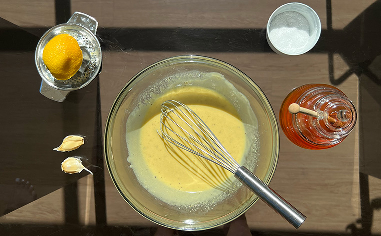 Liquid Gold Creamy Tahini Dressing with honey, garlic, lemon juice, and salt.