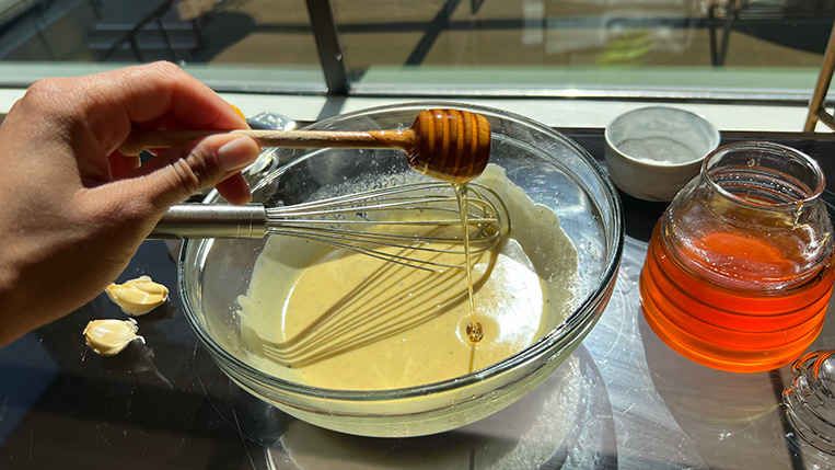 Liquid Gold Tahini Dressing with a honey drizzle.
