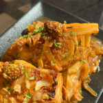 Charred Cabbage with Crispy Chicken Skin.