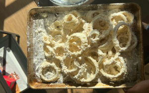 Crispy Onion Rings coated in batter.